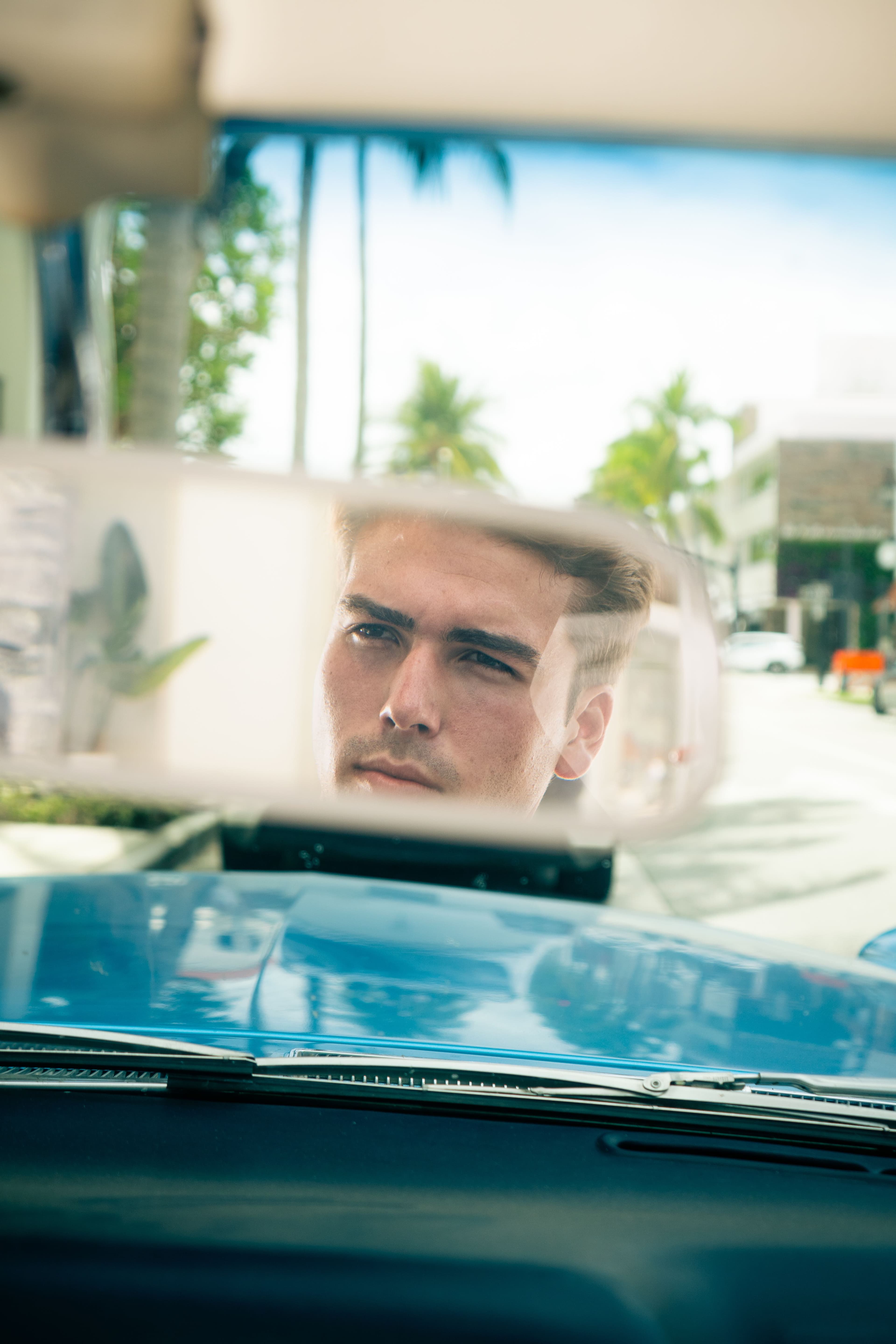 Christian Utne reflection in car mirror