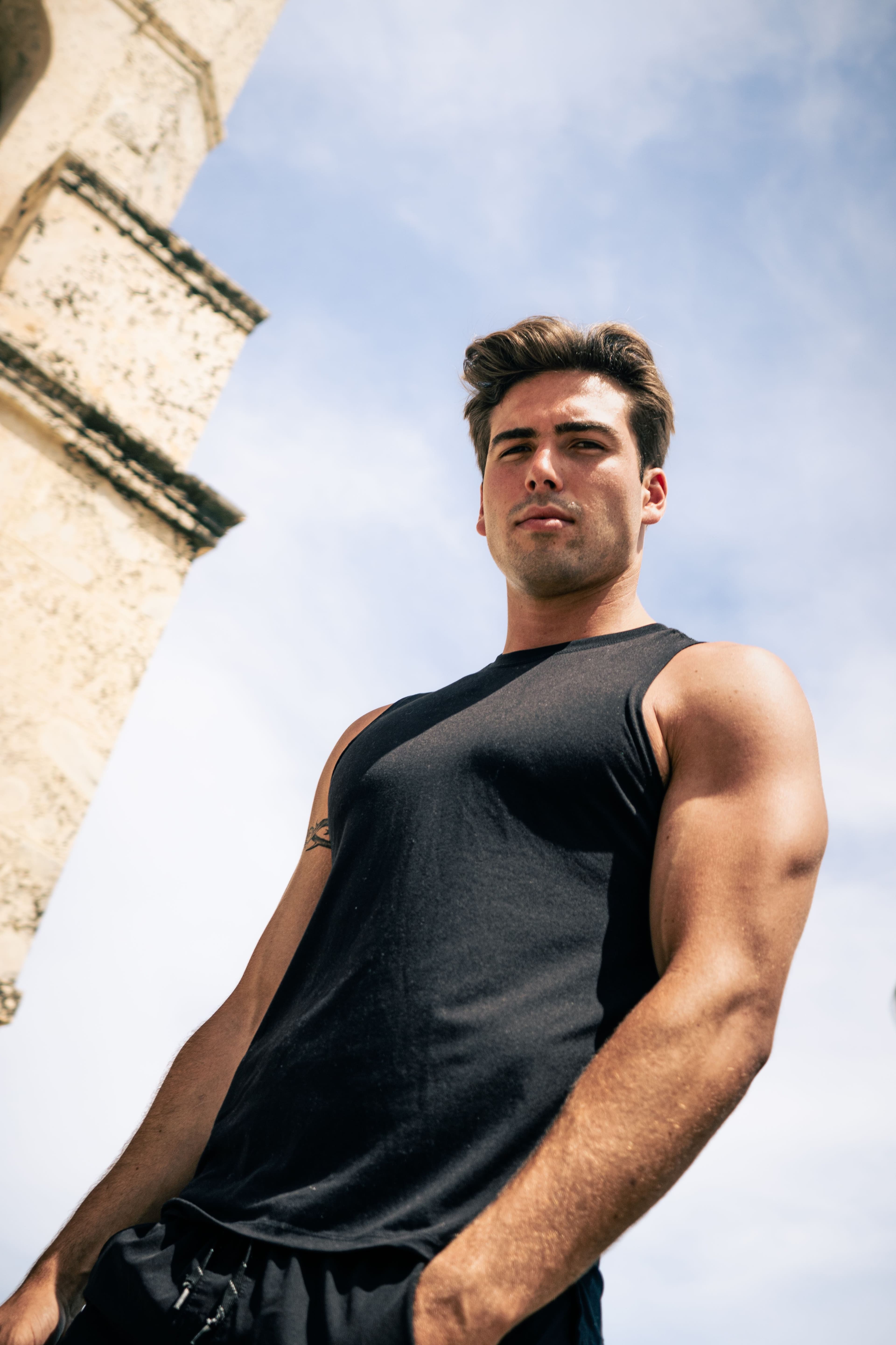 Christian Utne in black tank top against the sky